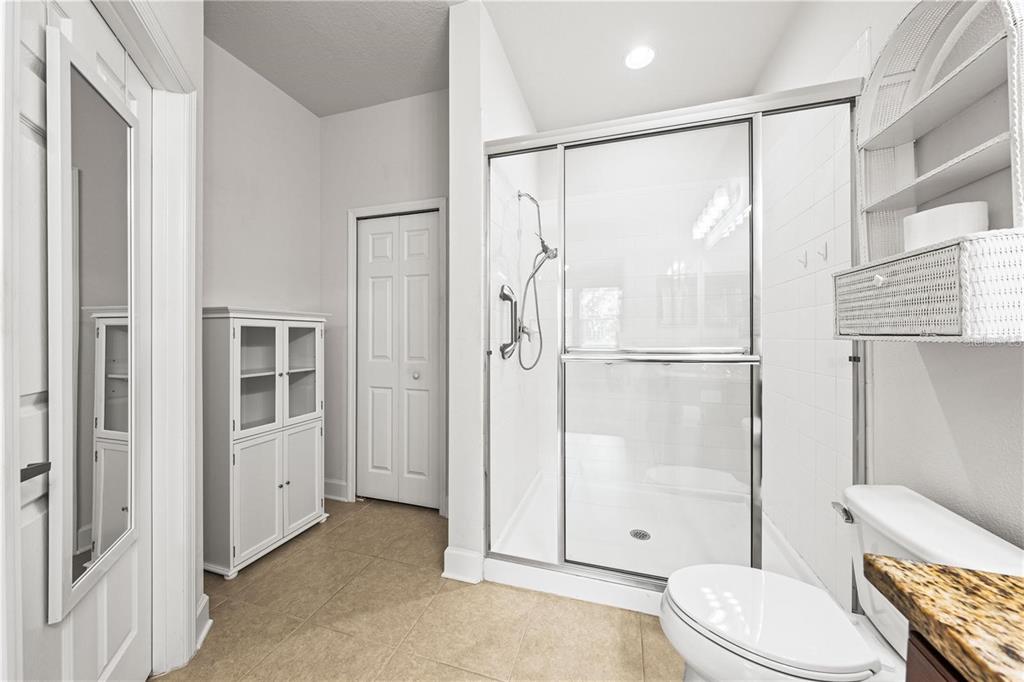 8437 Nandina Drive Sarasota, FL 34240 - Photo 16 of 26 a bathroom with a toilet and a shower