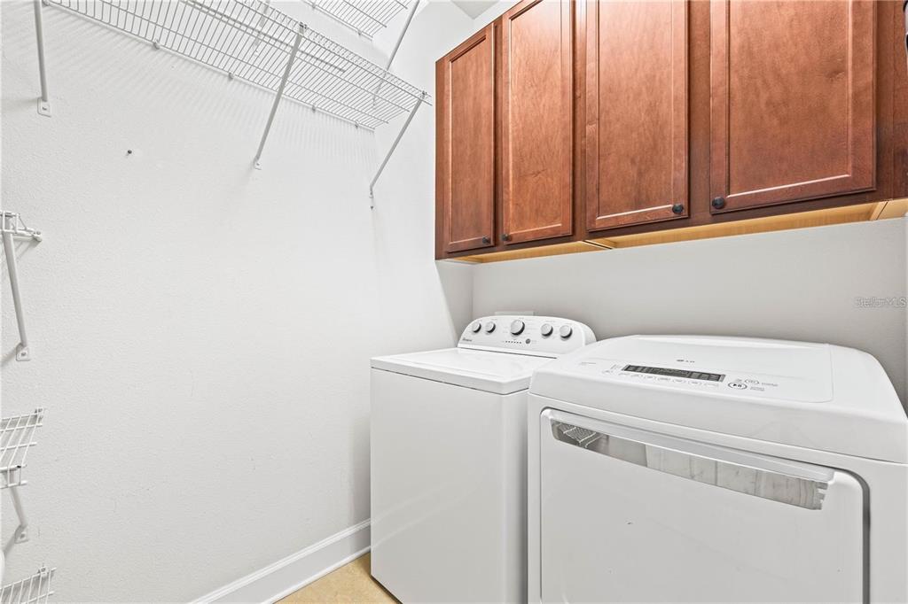 8437 Nandina Drive Sarasota, FL 34240 - Photo 23 of 26 a utility room with dryer and washer