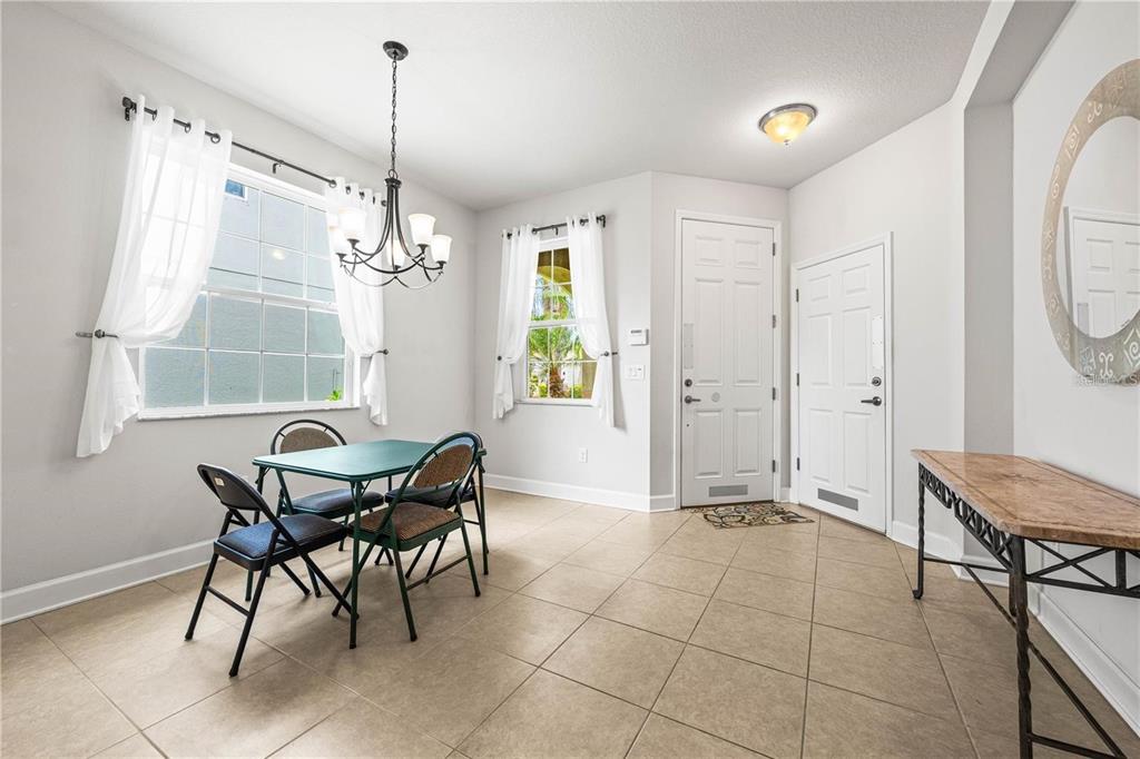 8437 Nandina Drive Sarasota, FL 34240 - Photo 4 of 26 a view of a dining room with furniture and a window
