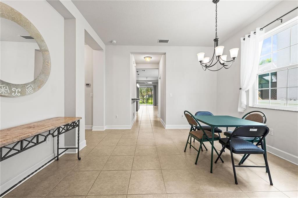 8437 Nandina Drive Sarasota, FL 34240 - Photo 5 of 26 a dining room with furniture and window