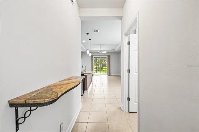 a view of a hallway with seating area