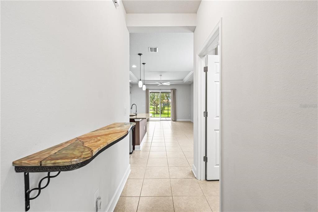 8437 Nandina Drive Sarasota, FL 34240 - Photo 7 of 26 a view of a hallway with seating area