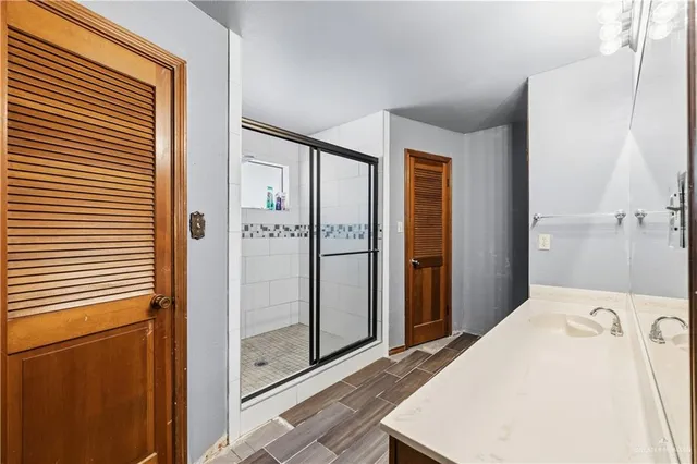 a en suite bathroom with a sink and mirror