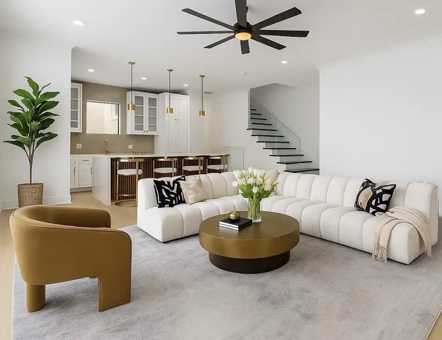 a living room with furniture and a potted plant
