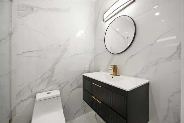 a bathroom with a sink a mirror and bathtub