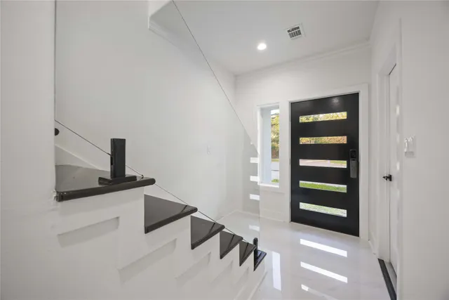a kitchen with granite countertop a sink and a stove top oven
