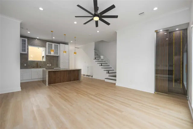 a view of a kitchen with a sink and a window