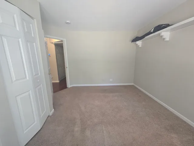 a view of hallway with closet