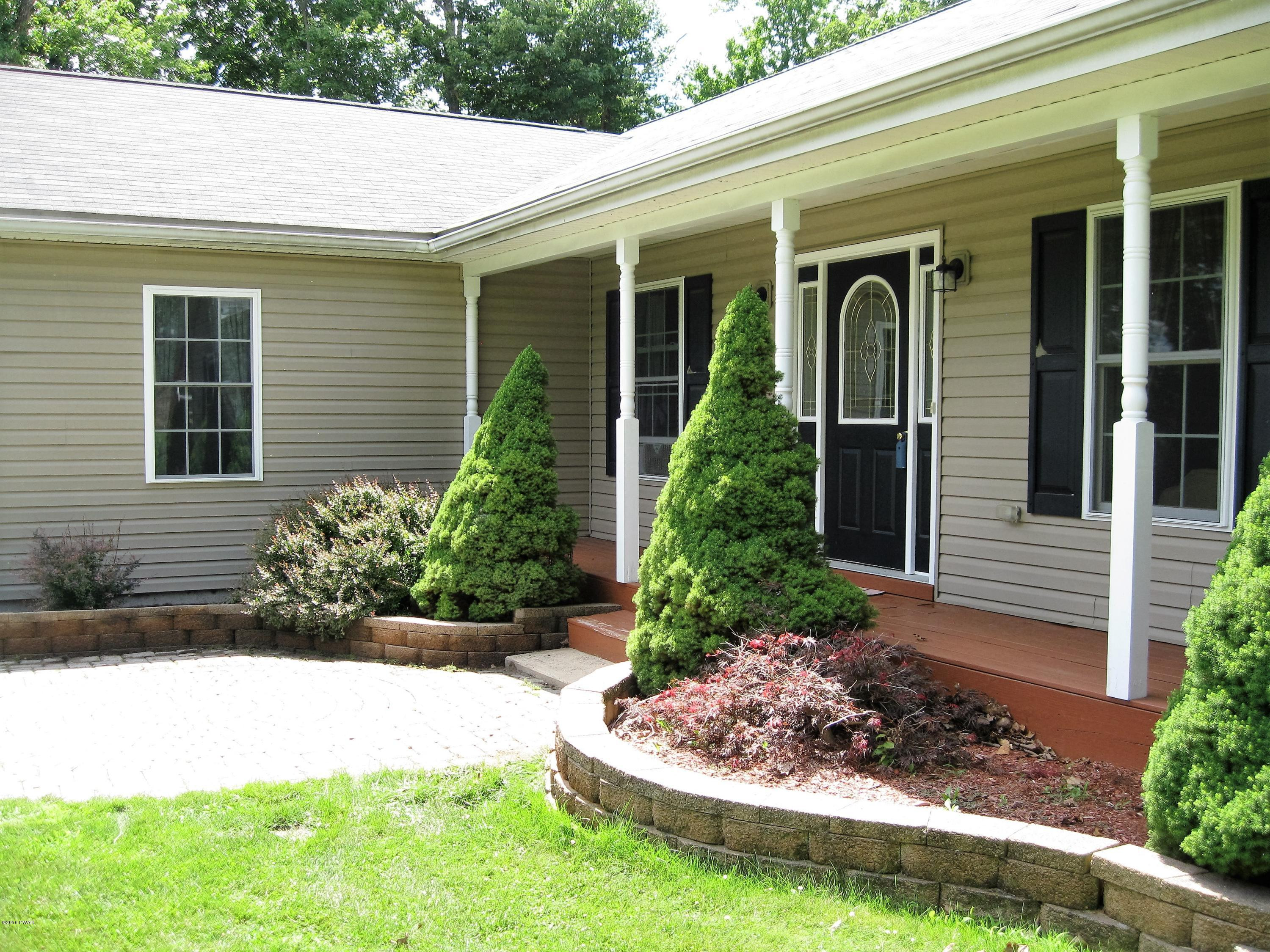 137 Caribou Road Dingmans Ferry, PA 18328 - Photo 5 of 34 a front view of a house with a yard