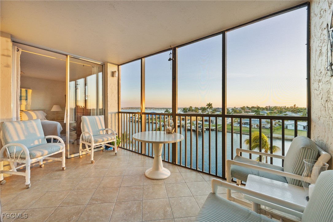 4260 Southeast 20th Place, Unit 502 Cape Coral, FL 33904 - Photo 1 of 49 a view of a balcony with chairs