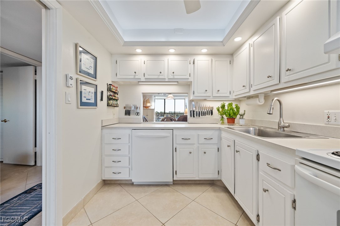 4260 Southeast 20th Place, Unit 502 Cape Coral, FL 33904 - Photo 11 of 49 a kitchen with cabinets and window