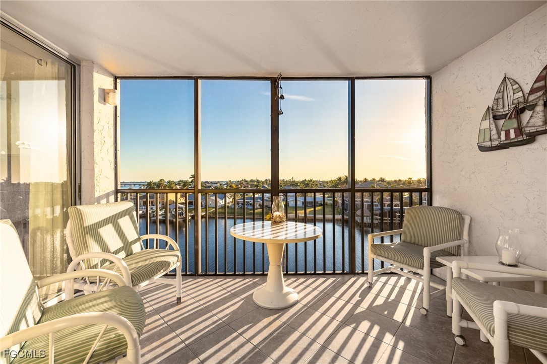 4260 Southeast 20th Place, Unit 502 Cape Coral, FL 33904 - Photo 21 of 49 a view of a balcony with chairs