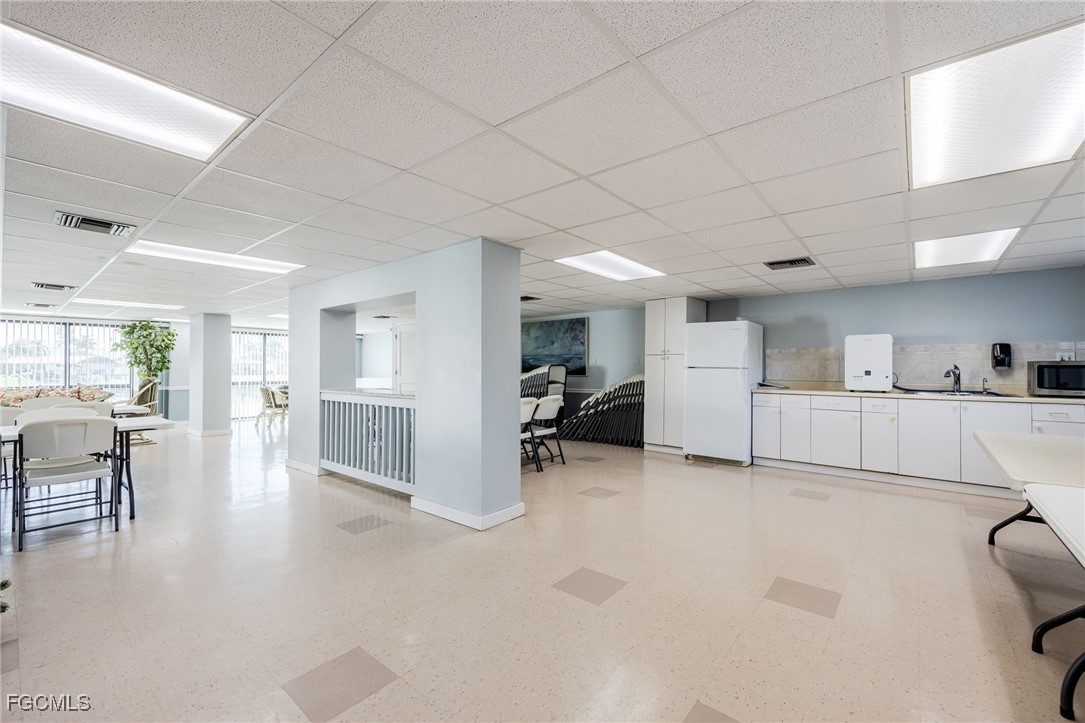 4260 Southeast 20th Place, Unit 502 Cape Coral, FL 33904 - Photo 34 of 49 a view of a livingroom with furniture and a kitchen