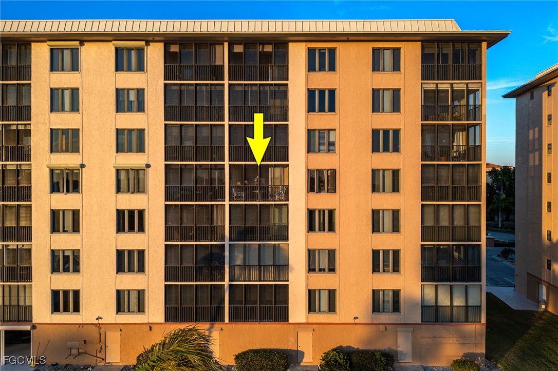4260 Southeast 20th Place, Unit 502 Cape Coral, FL 33904 - Photo 40 of 49 a front view of a building with a window