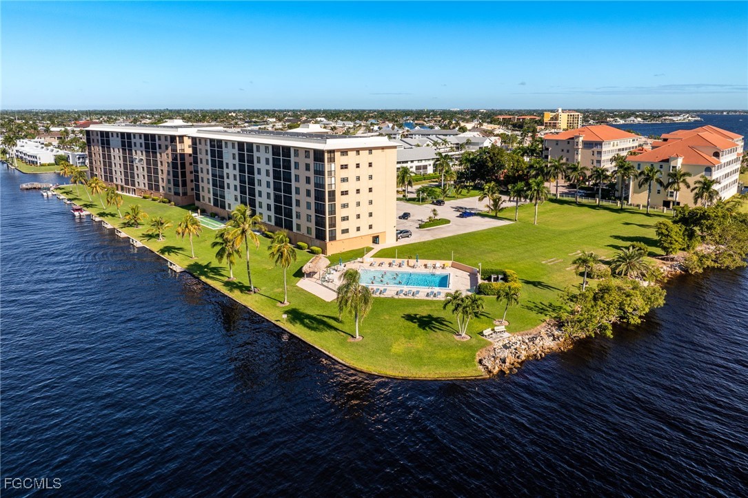 4260 Southeast 20th Place, Unit 502 Cape Coral, FL 33904 - Photo 44 of 49 swimming pool view with a seating space
