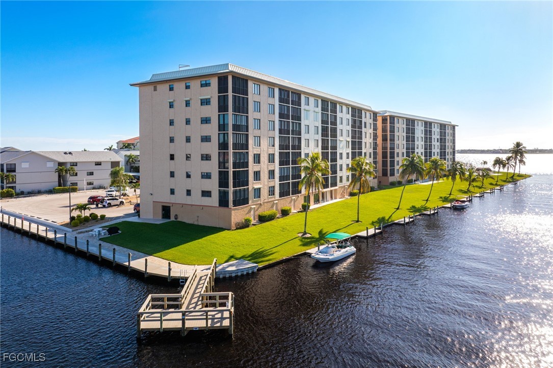 4260 Southeast 20th Place, Unit 502 Cape Coral, FL 33904 - Photo 47 of 49 a view of an ocean with a swimming pool