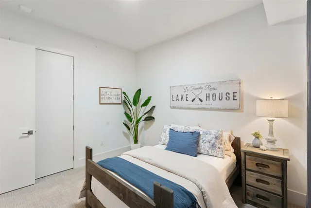 a bedroom with a bed and a table in it