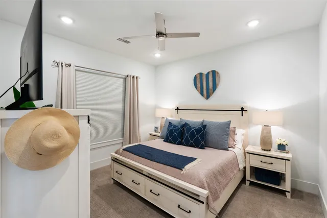 a bedroom with a bed and cabinets