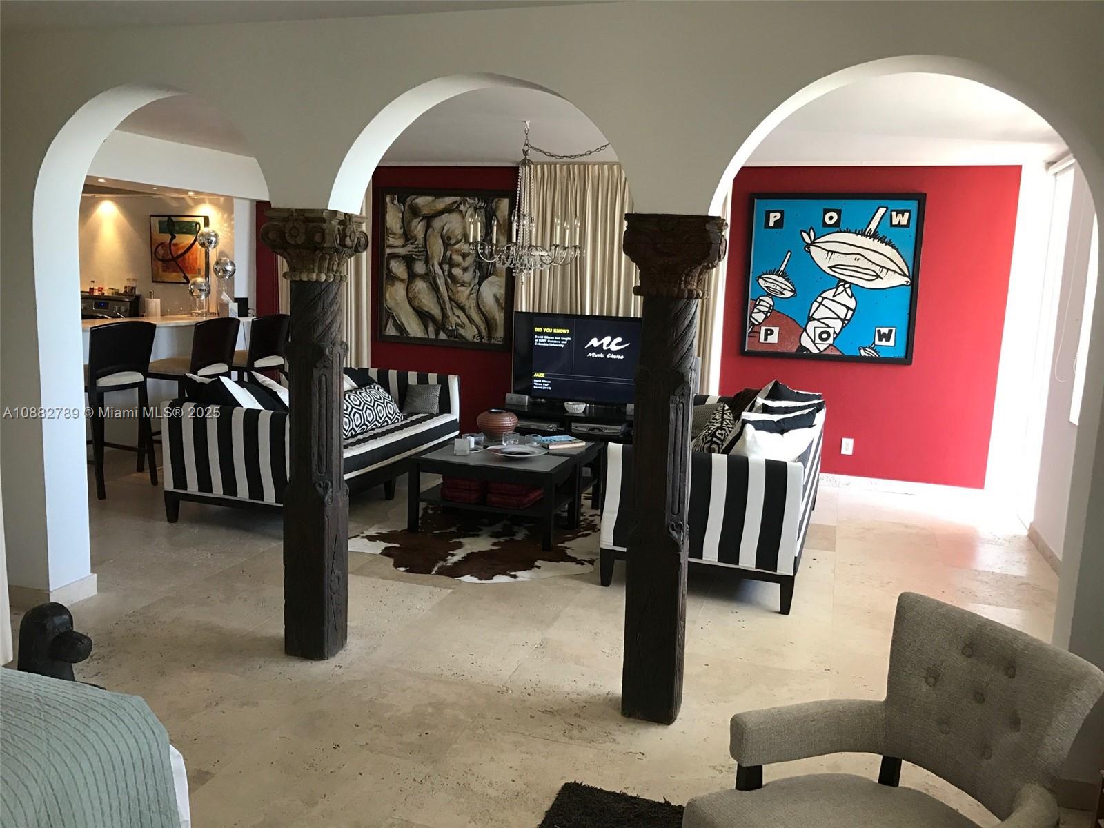 100 Lincoln Road, Unit 644 Miami Beach, FL 33139 - Photo 12 of 46 a bedroom with furniture and a flat screen tv