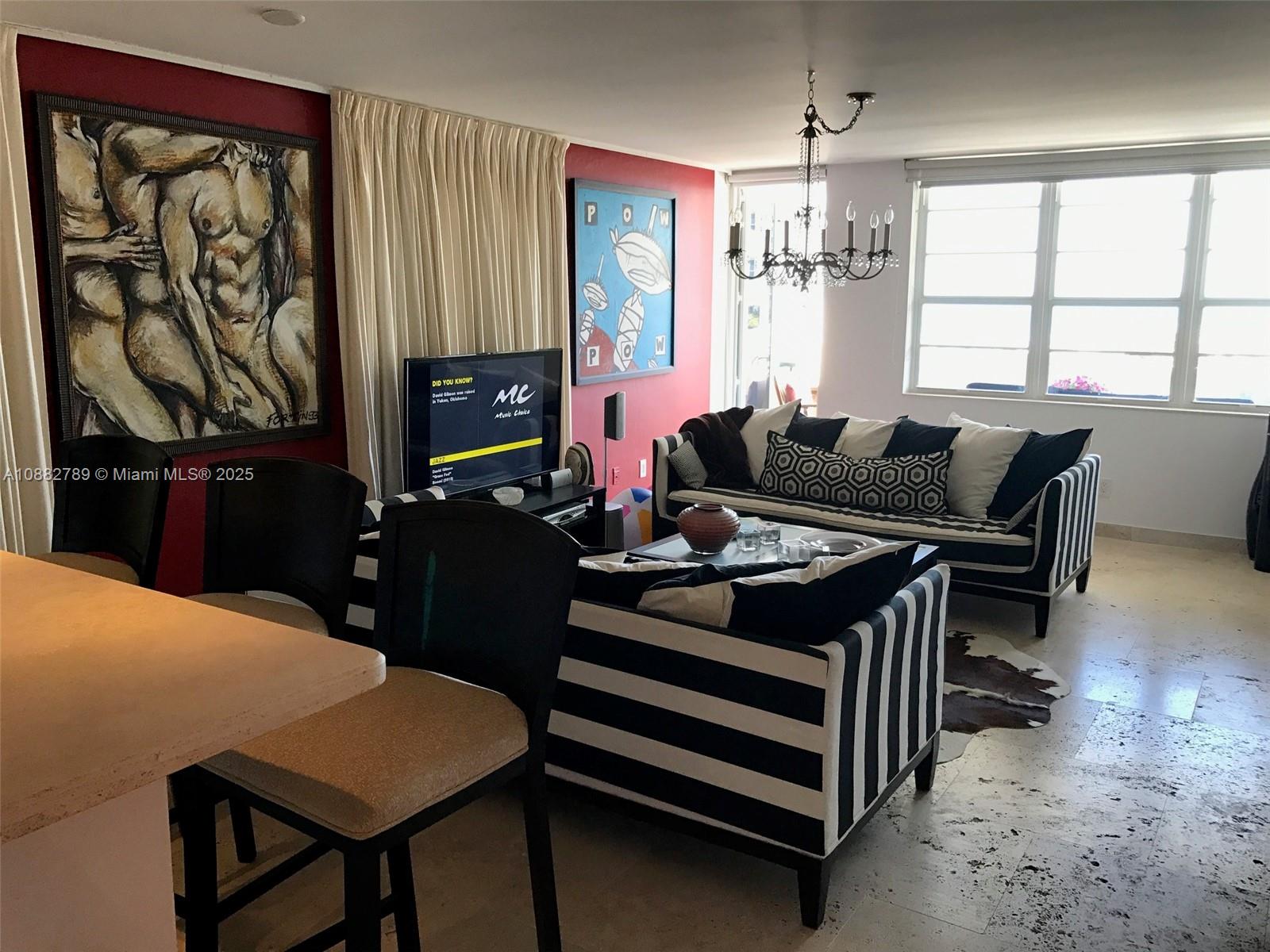 100 Lincoln Road, Unit 644 Miami Beach, FL 33139 - Photo 14 of 46 a living room with furniture a desk and chair with windows