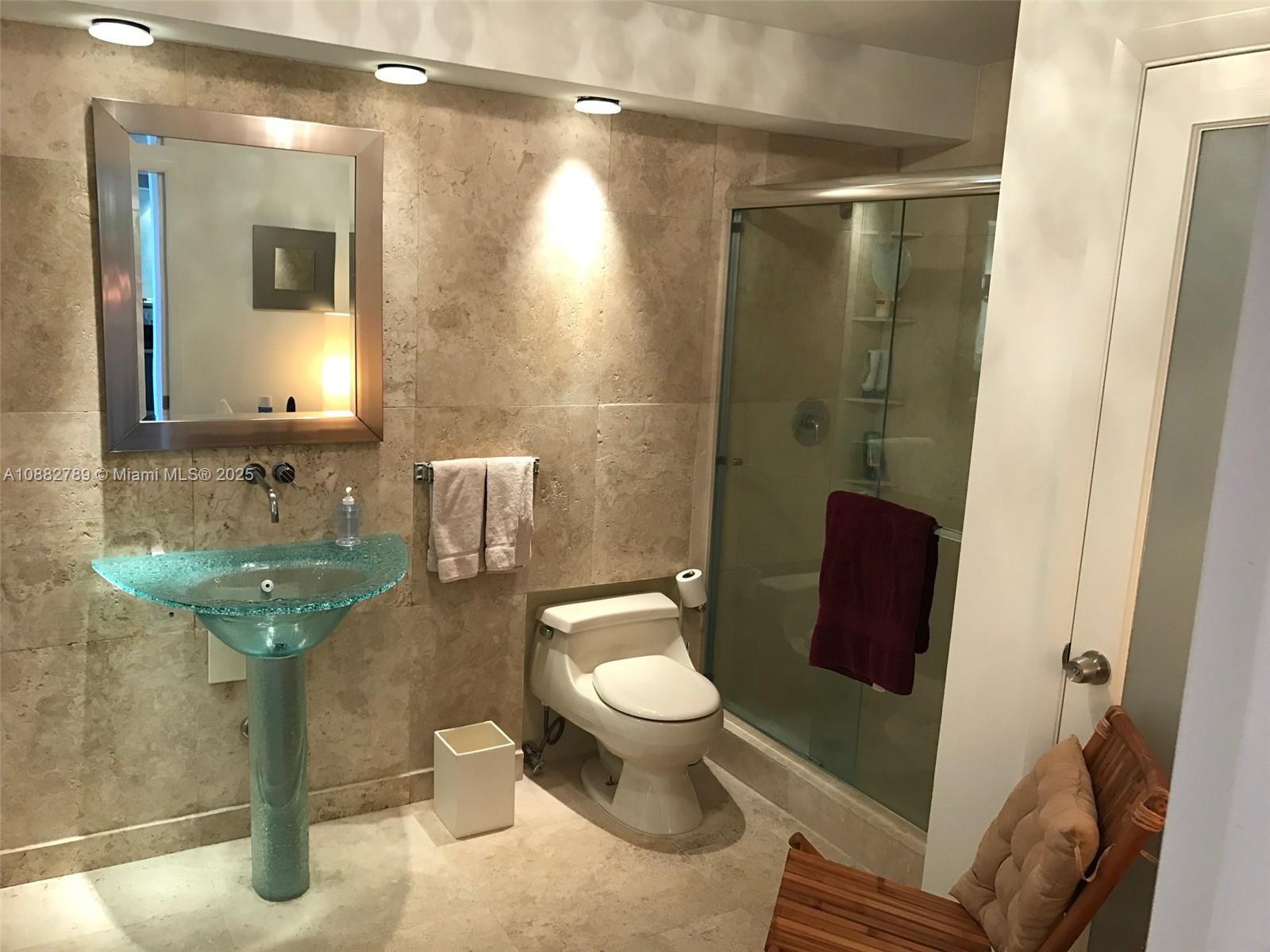 100 Lincoln Road, Unit 644 Miami Beach, FL 33139 - Photo 26 of 46 a bathroom with a sink a toilet and shower