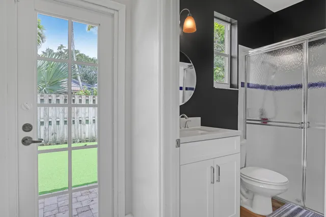 a bathroom with a toilet a sink and tub