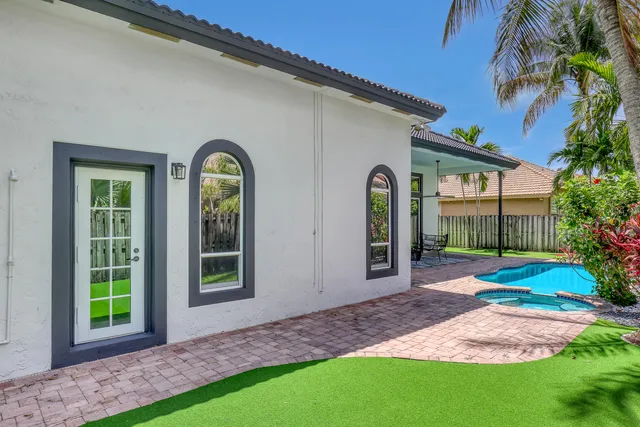 a view of a front of a house with a yard