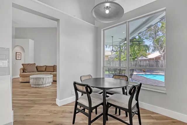 a dining room with furniture and window