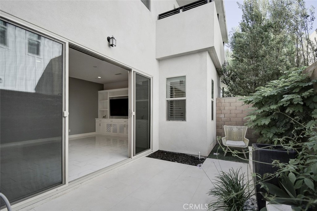 148 Spectacle Irvine, CA 92618 - Photo 12 of 47 a balcony view with a potted plant and a window