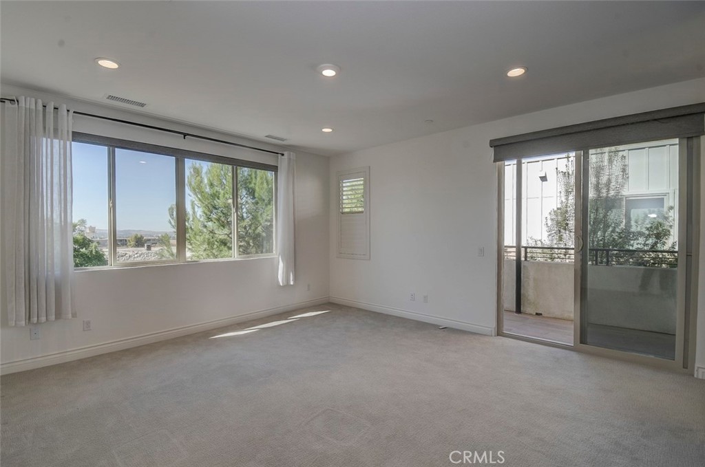 148 Spectacle Irvine, CA 92618 - Photo 18 of 47 an empty room with windows and closet