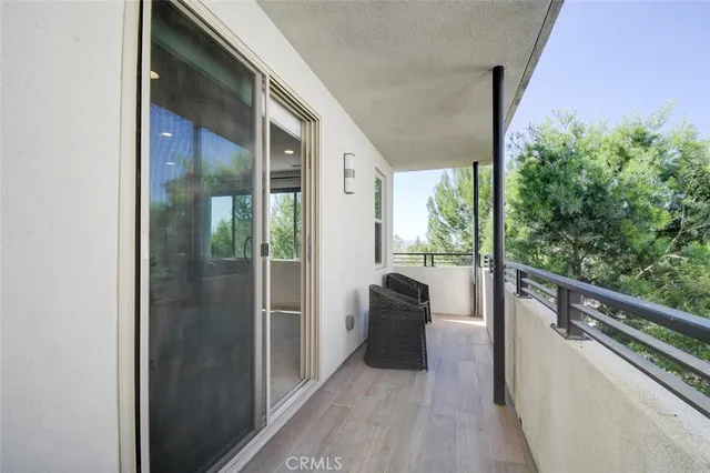 a view of balcony with furniture
