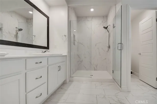 a bathroom with a bathtub and a sink