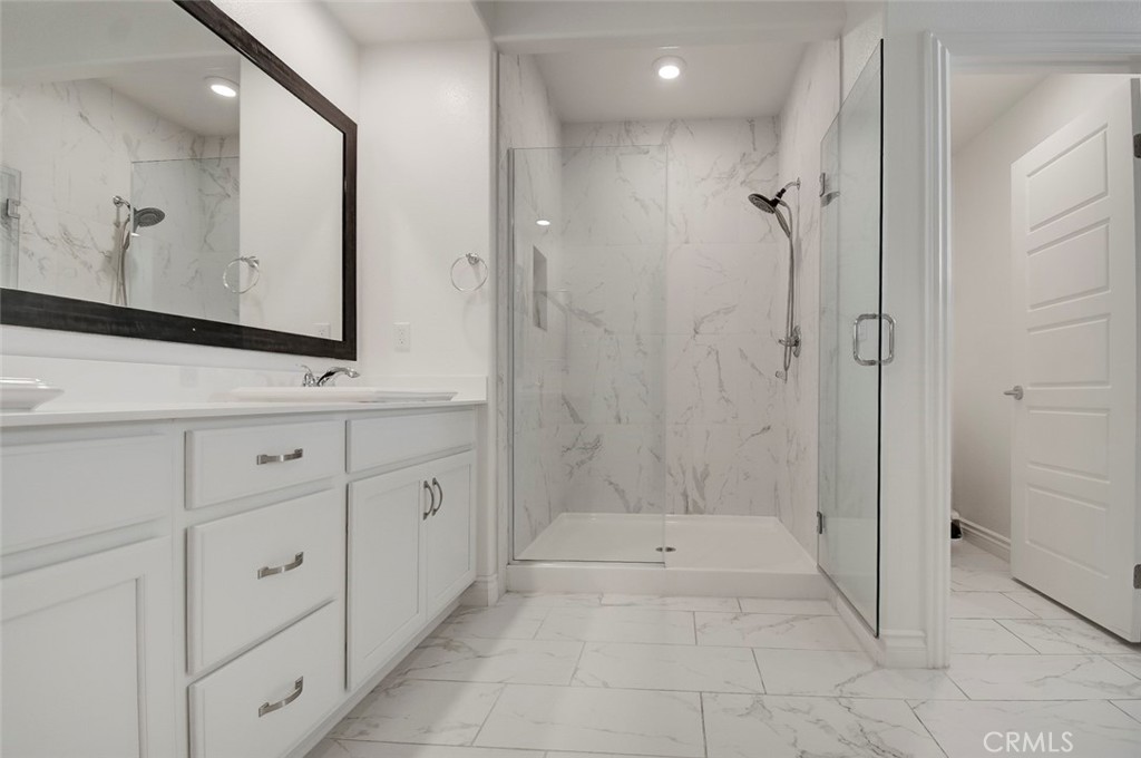 148 Spectacle Irvine, CA 92618 - Photo 24 of 47 a bathroom with a bathtub and a sink