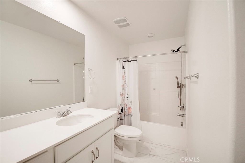 148 Spectacle Irvine, CA 92618 - Photo 29 of 47 a bathroom with a sink a toilet and shower