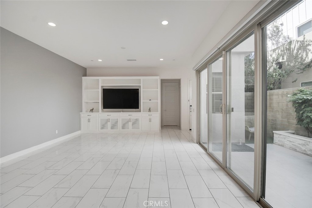 148 Spectacle Irvine, CA 92618 - Photo 3 of 47 a view of a livingroom with an empty space and the hallway