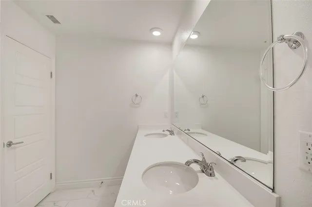 a bathroom with a sink and shower