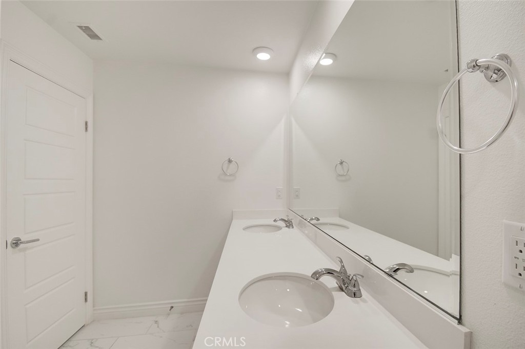 148 Spectacle Irvine, CA 92618 - Photo 31 of 47 a bathroom with a sink and shower