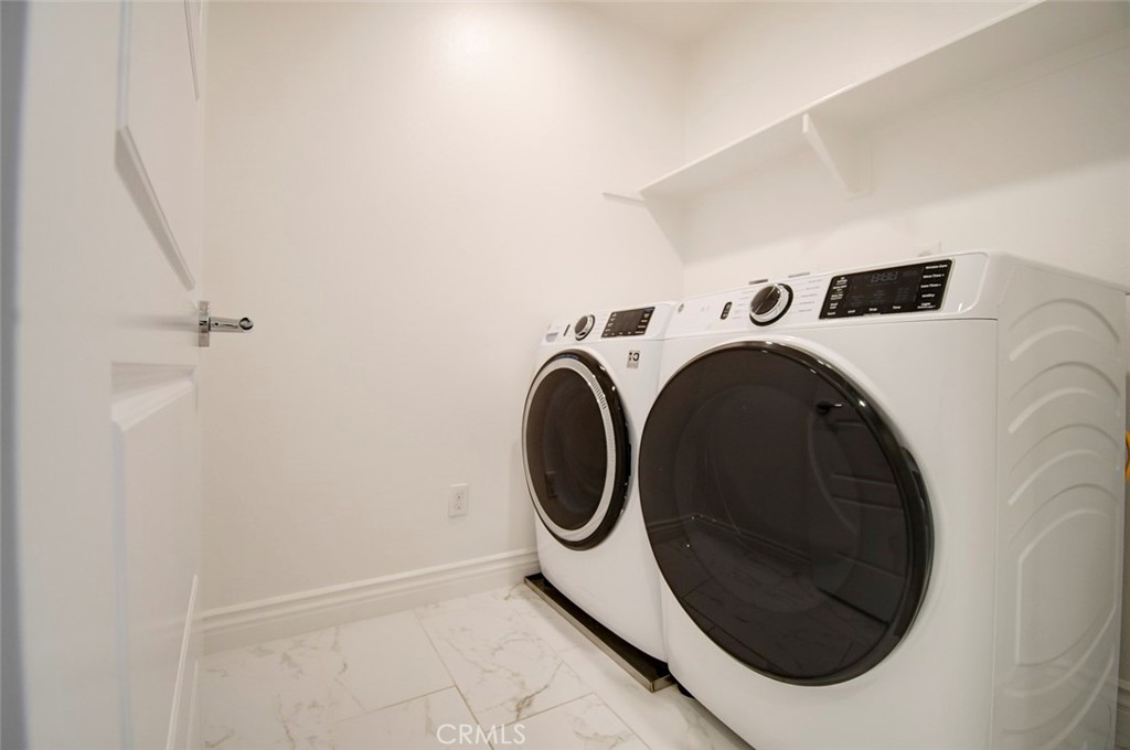148 Spectacle Irvine, CA 92618 - Photo 34 of 47 a utility room with dryer and washer