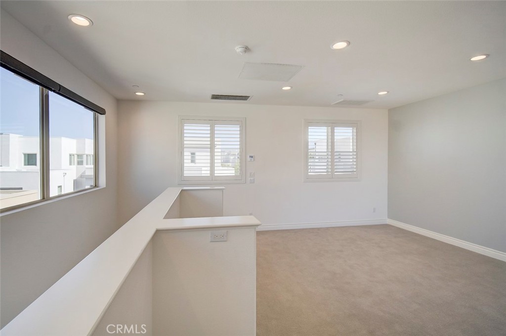 148 Spectacle Irvine, CA 92618 - Photo 36 of 47 a view of an empty room with a window