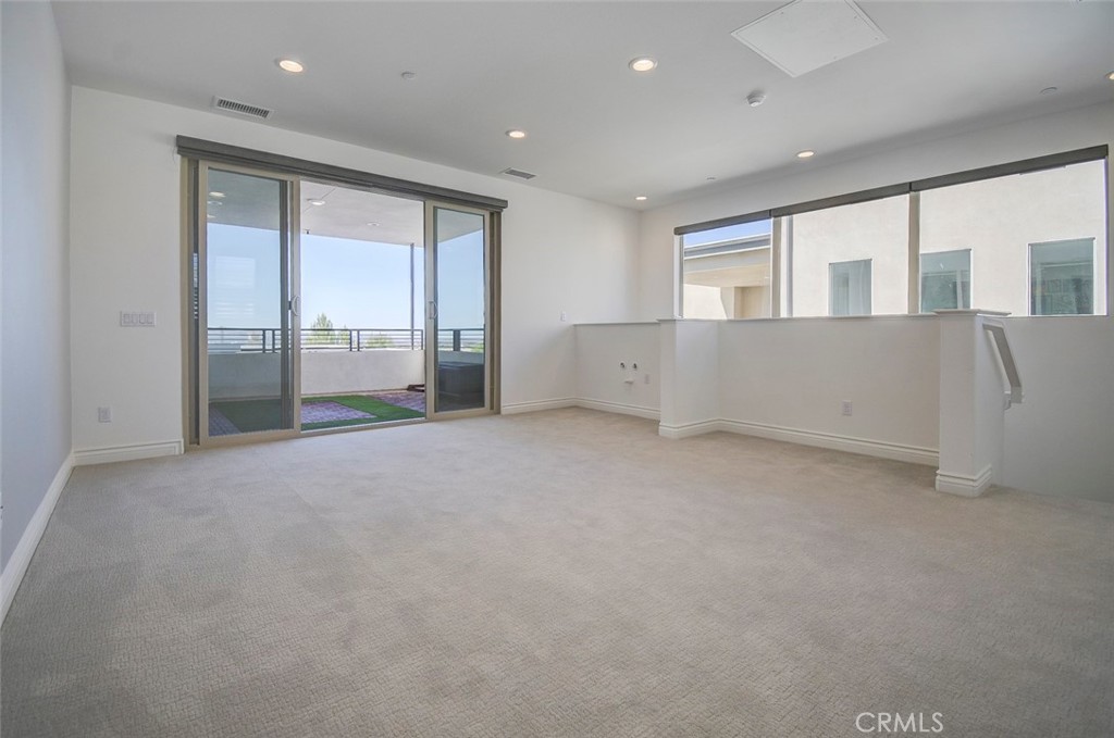 148 Spectacle Irvine, CA 92618 - Photo 38 of 47 a view of an empty room with a window