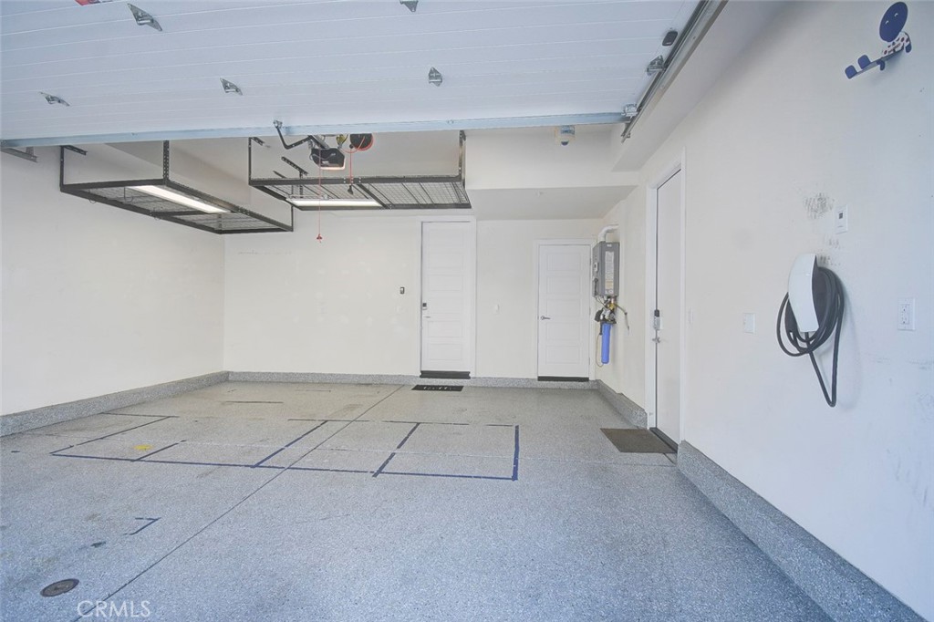 148 Spectacle Irvine, CA 92618 - Photo 43 of 47 a view of a room with racks on the wall