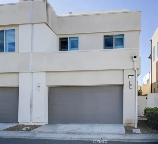 a view of a swimming pool with a garden and trees