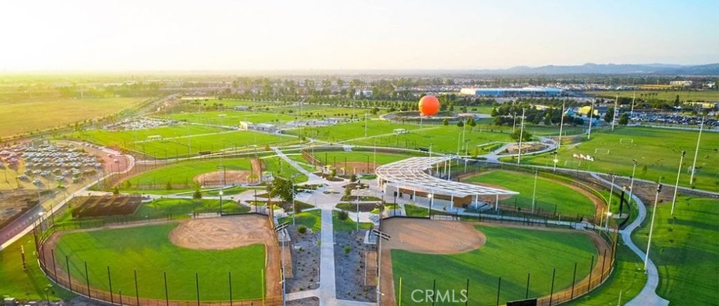 148 Spectacle Irvine, CA 92618 - Photo 46 of 47 a view of a swimming pool with a garden and trees