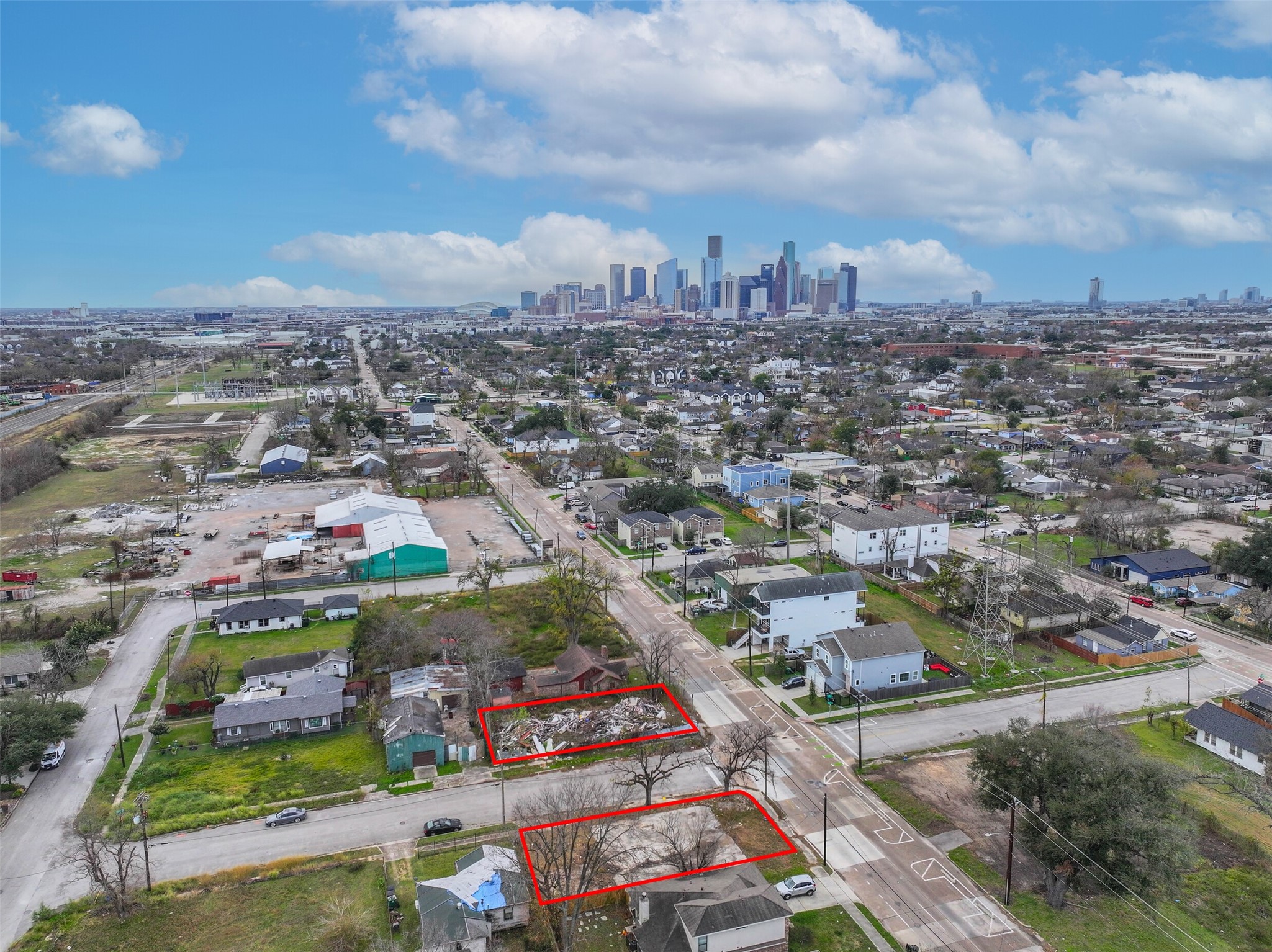 an aerial view of residential houses with outdoor space