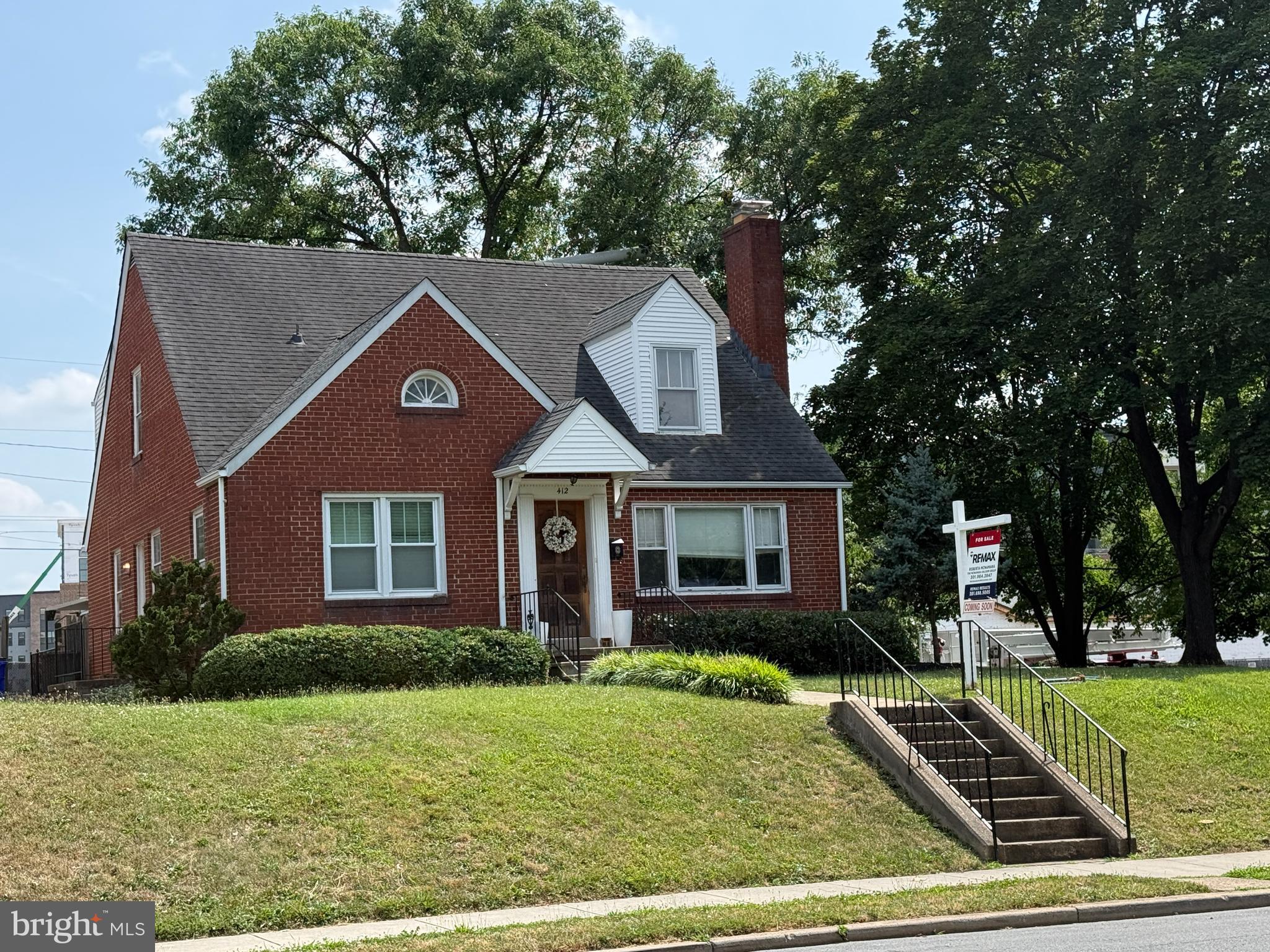 412 Carroll Parkway Frederick, MD 21701 - Photo 1 of 11 a front view of a house with garden