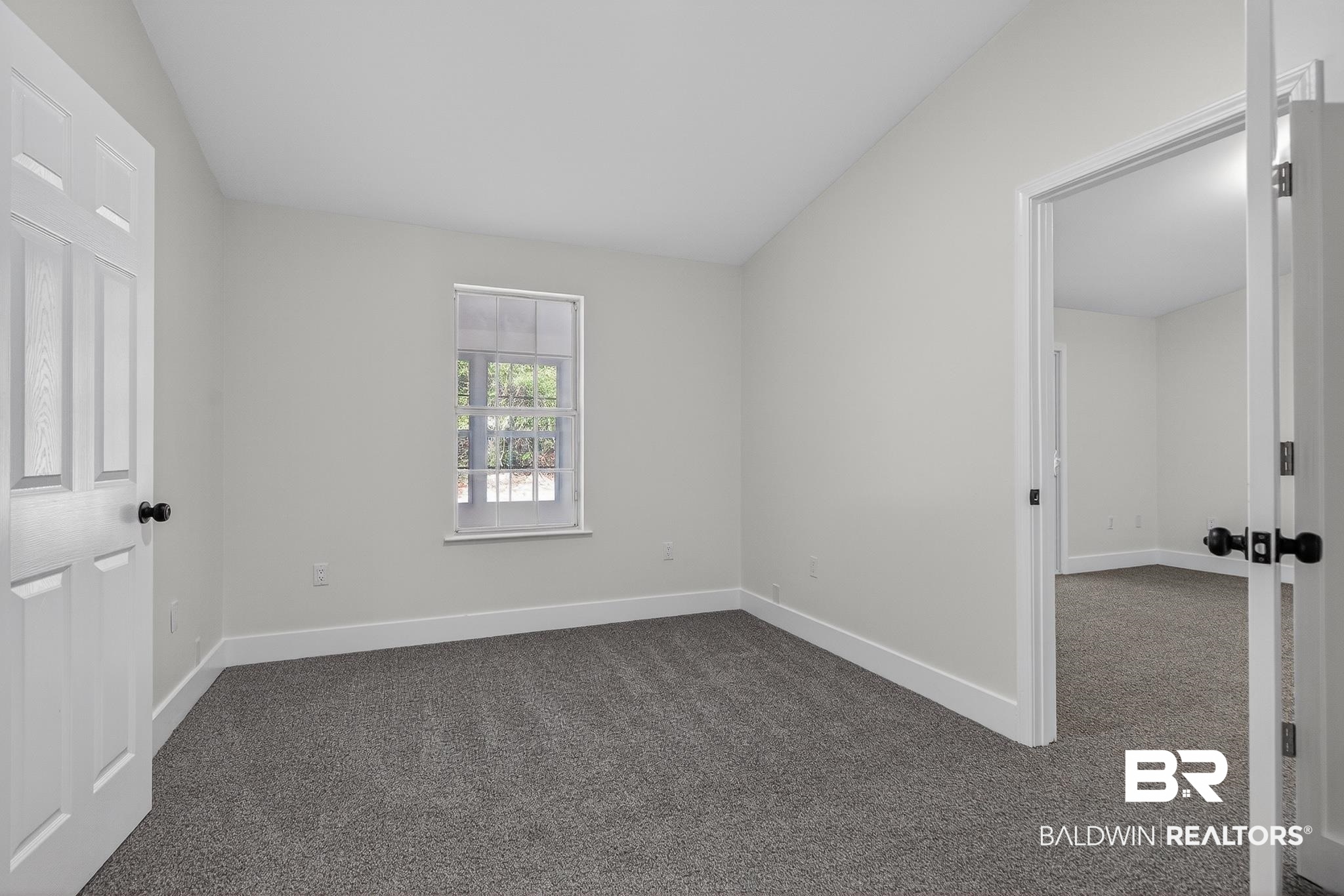 10650 Old Pascagoula Road Theodore, AL 36582 - Photo 57 of 77 Unfurnished bedroom with dark carpet and lofted ceiling