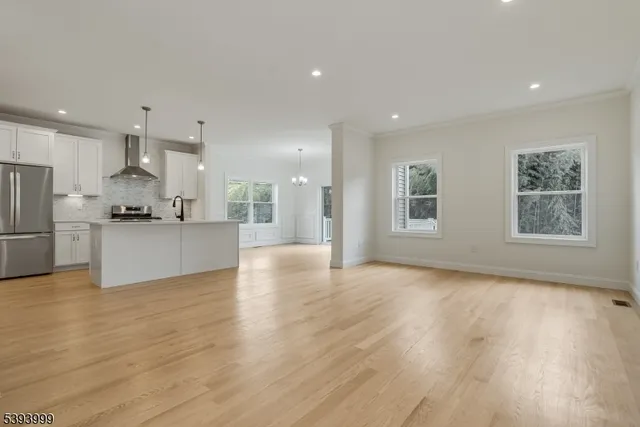 a view of kitchen with refrigerator and window