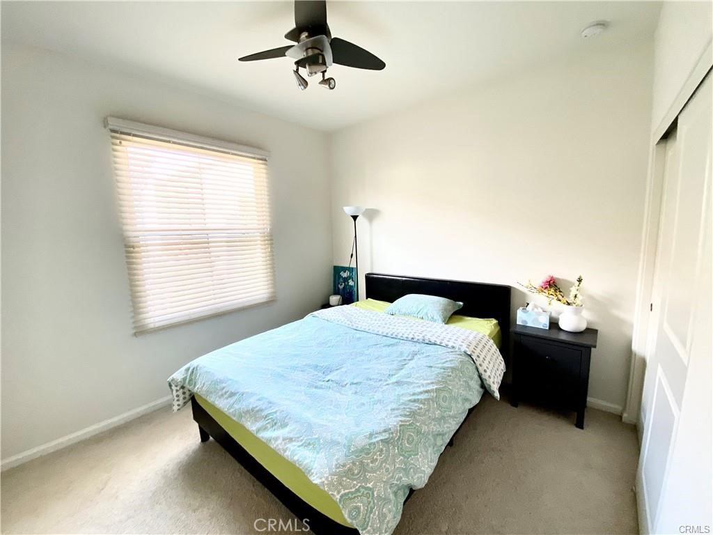 62 Emerald Clover Irvine, CA 92620 - Photo 13 of 15 a bedroom with a bed and window