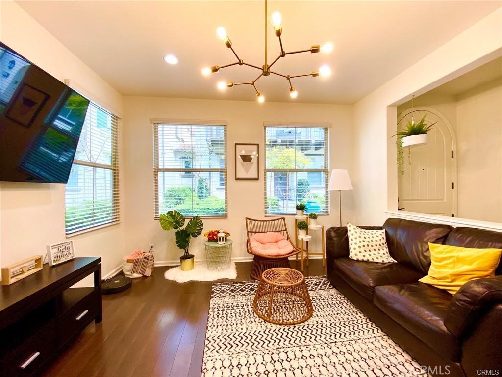 62 Emerald Clover Irvine, CA 92620 - Photo 3 of 15 a living room with furniture and a flat screen tv
