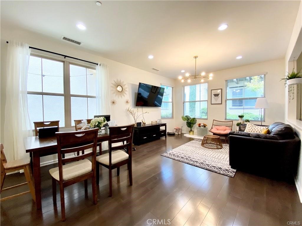 62 Emerald Clover Irvine, CA 92620 - Photo 4 of 15 a living room with furniture and a flat screen tv
